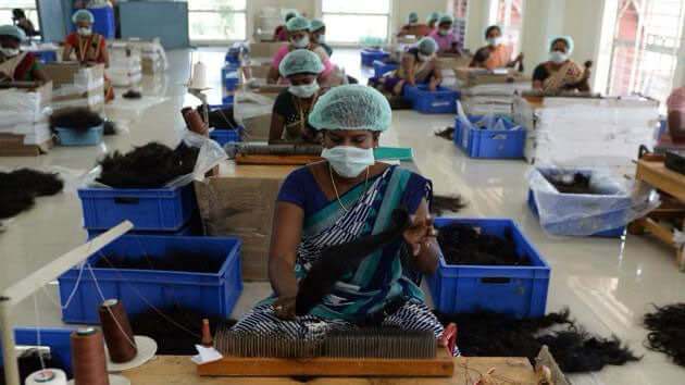 Workers at the BigLove Indian Hair Factory in Chennai India
