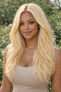 Full 100g bundle of Straight 613 Blonde Raw Indian Hair, showcasing a silky platinum luster and healthy, thick ends.