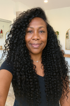 Lady wearing Raw Indian Curly Hair Extensions
