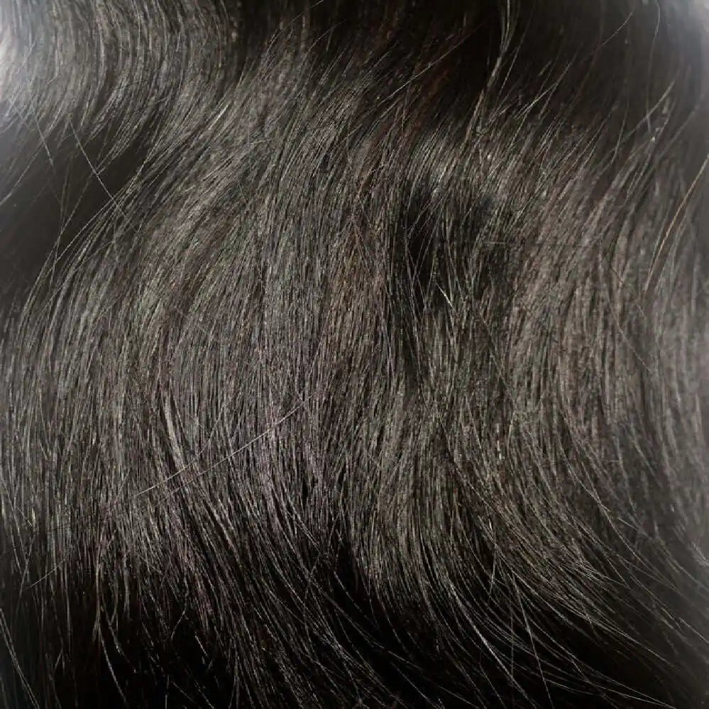 A close up shot of the texture of Straight Raw Indian Hair