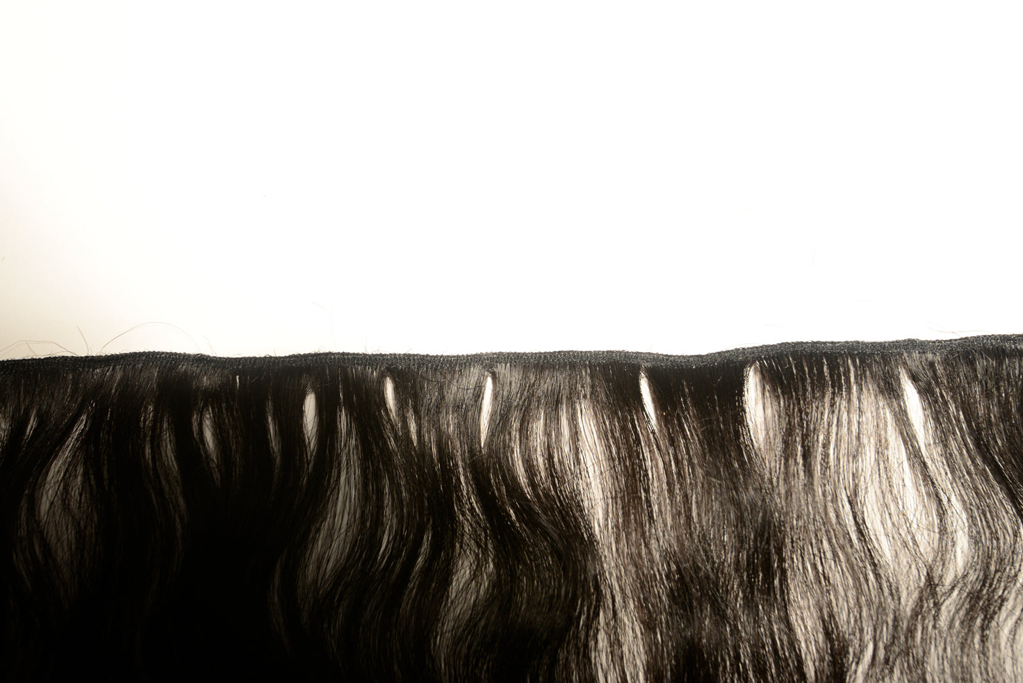 Close up of wefts on raw Indian hair Extensions for you to buy online