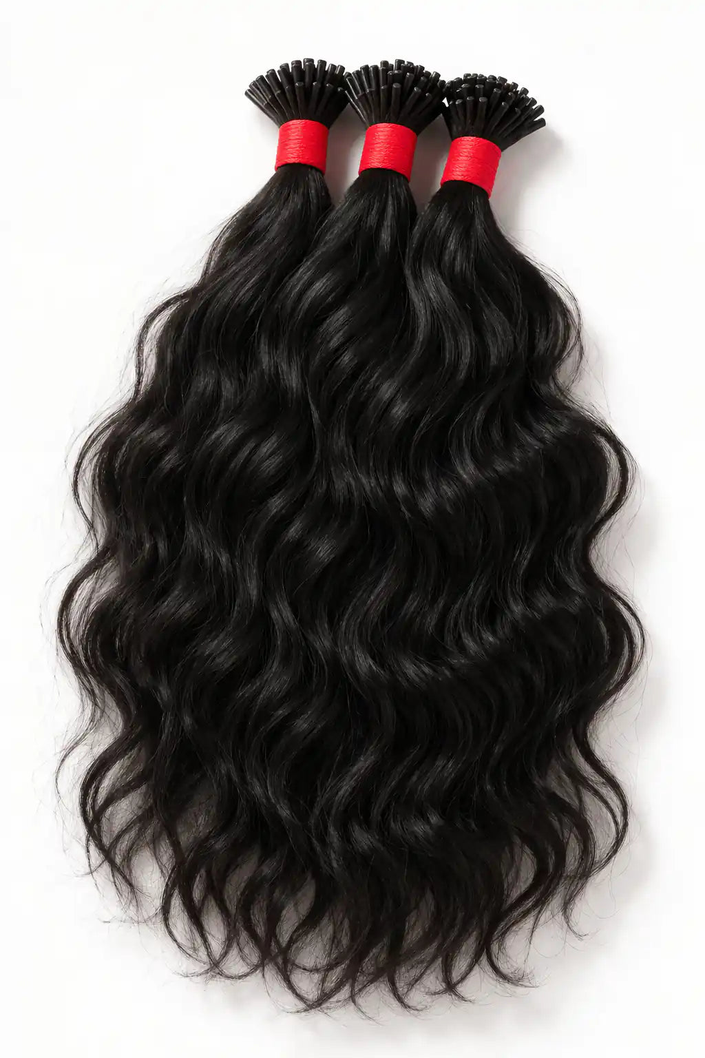 Natural black wavy keratin I-tip extensions to add significant length and volume while blending naturally with the a persons hair.