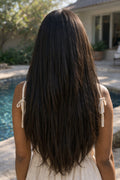 Rear profile of a model featuring Straight Raw Indian Hair Extensions, showcasing the consistent density from the roots to the healthy, thick ends.