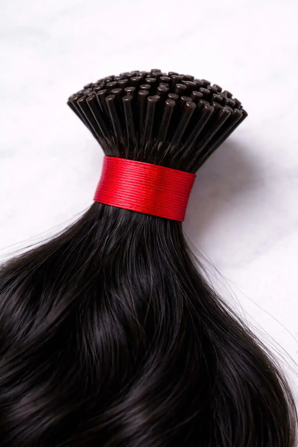 BigLove Wavy Raw Indian Keratin I-tip extensions featuring 100% unprocessed single-donor wavy hair with durable, high-quality bonds for professional installs.