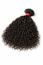 Thick, healthy ends of a 100g curly raw Indian bulk hair bundle, hand-selected at the Chennai factory to ensure superior density and minimal shedding.