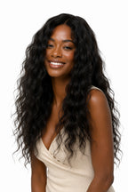 Model featuring a loose curly textured raw Indian hair install, showcasing how beautifully the natural curly patterns blend with premium natural hair textures.