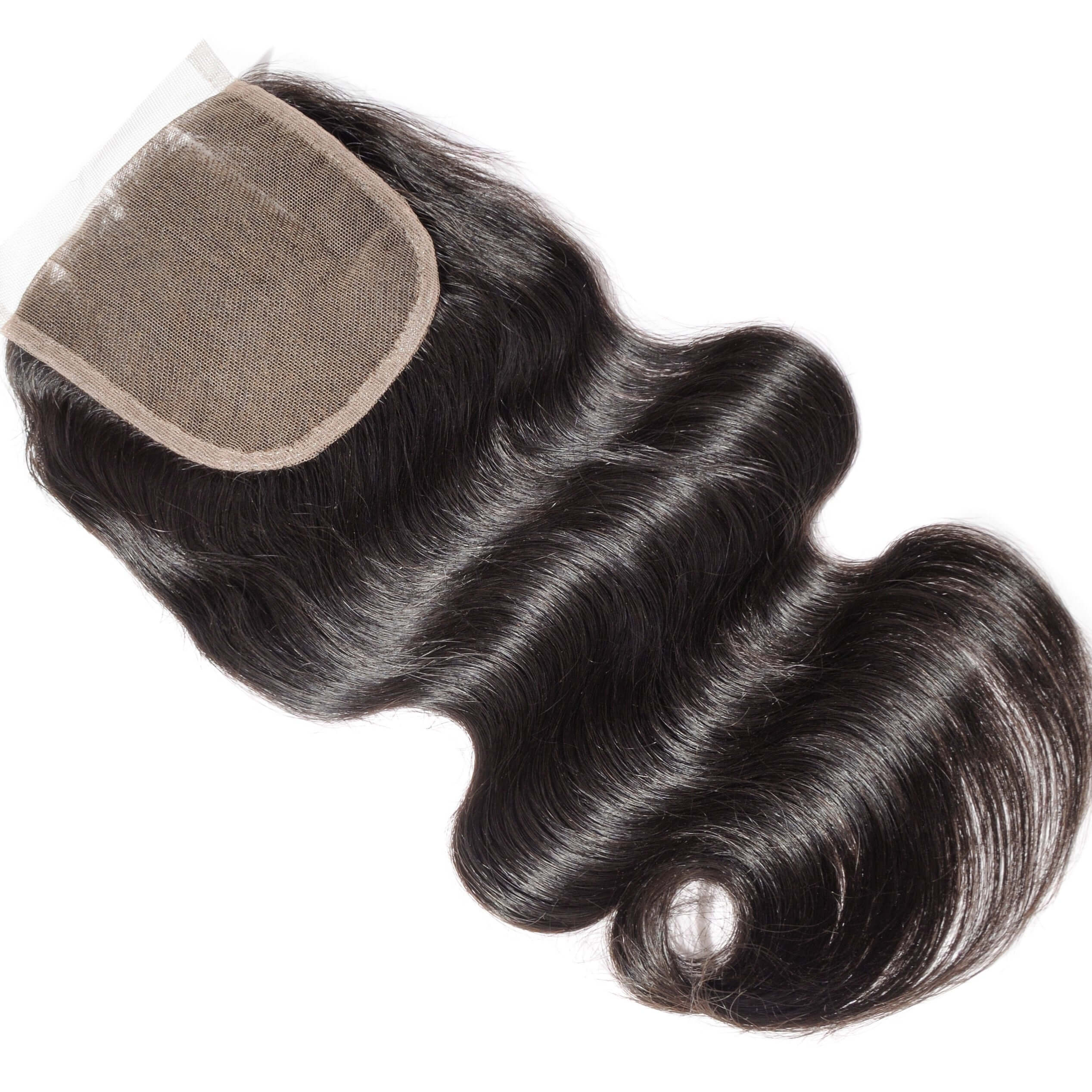 Macro view of a raw Indian hair closure sample showing hand-tied single knots for a realistic, non-bulky scalp appearance.
