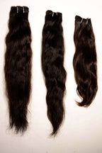 Detailed view of raw Indian hair samples demonstrating intact cuticles and reinforced weft construction for long-term durability.