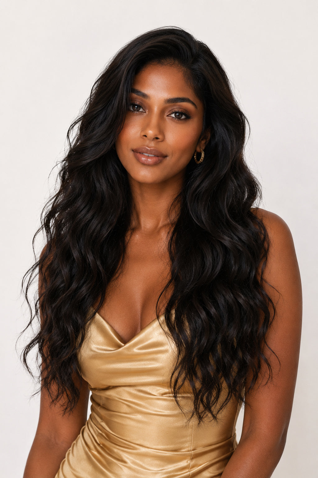 Model featuring a glamorous, heat-styled look using premium raw wavy hair, demonstrating how beautifully the hair holds a structured wave.