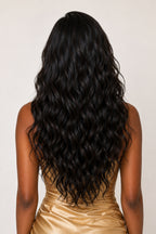 Rear view of Model showcasing raw Indian wavy hair flat-ironed silky straight, proving the incredible versatility and premium quality of unaltered temple hair